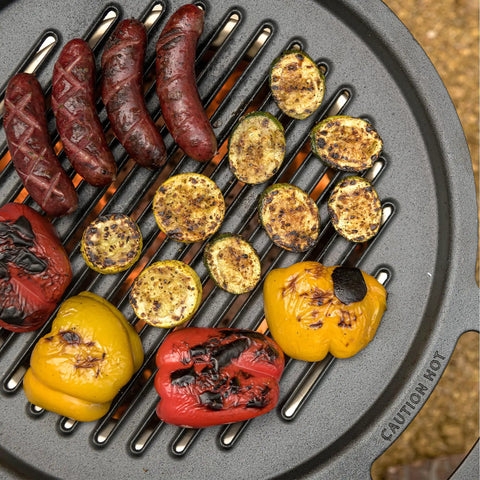 Large Cast Iron Grill Top For Bonfire And Yukon Fire Pit Outdoor Cooking Surface Seventeen And Three Quarters Inch 17 Lbs Fire Pit Accessory For Flame To Table Meals with grilled vegetables and sausages