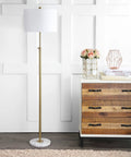 65-Inch Brass Gold And White Marble Adjustable LED Floor Lamp With White Linen Shade next to dresser in living room