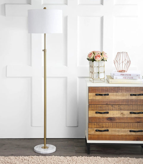 65-Inch Brass Gold And White Marble Adjustable LED Floor Lamp With White Linen Shade next to dresser in living room