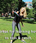 Woman playing with Soft Catch Flying Disc Red For Indoor Outdoor Fun in a park setting