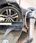 Gutter-cleaning pressure washer attachment with 1/4-inch quick-connect and 240° pivot, shown spraying water.