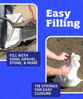 Person filling Heavy Duty Sand Bags With Tie Strings White 14x26 Inches 50 Lb Capacity Pack Of 100 UV Protected with sand and tying strings.