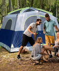 Group enjoying campsite beside Spacious 6 Person Waterproof Family Tent With Windproof Build And Easy Setup In Minutes, Dark Blue