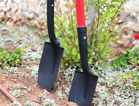 Round Point Digging Shovel With D Handle, 31 Inch Fiberglass Shaft, Pro Grade Comfort Grip Spade in garden setting.