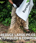 Person emptying debris bag from Heavy Duty 212cc 4 Cycle Chipper Shredder With 20 To 1 Reduction Turns Branches Up To 3 Inches Into Mulch