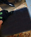 SMTFT24 Folding Tool With Precision Sight Holes For Depth Alignment used on sheet metal, shown cutting with cushioned grip and gloves