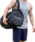 Man carrying XL Mesh Dive Duffel Bag For Scuba And Snorkeling Gear Heavy Duty Travel Duffle That Carries Mask Fins Snorkel