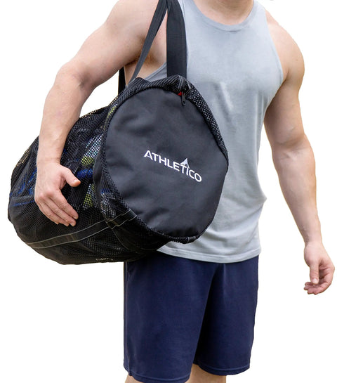 Man carrying XL Mesh Dive Duffel Bag For Scuba And Snorkeling Gear Heavy Duty Travel Duffle That Carries Mask Fins Snorkel