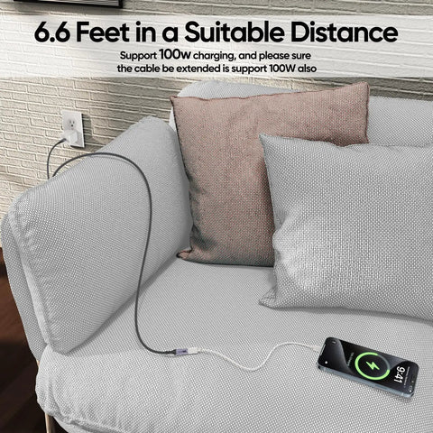 Straight Up Go Fast USB C Extension Cable 6.6 Feet Long in use charging a phone on a couch with decorative pillows.