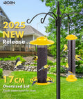 Outdoor Finch Feeder For Nyjer Seed Tube With Metal Mesh 13 Inch Length Weatherproof Roof And Tray 2 Lb Capacity Hanging Bird Feeder for backyards featuring yellow color and finches feeding.
