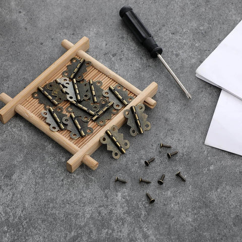 12Pcs Antique Bronze Butterfly Hinges 0.79 x 0.67 Inch With 48 Screws on a wooden tray for jewelry boxes and DIY crafts
