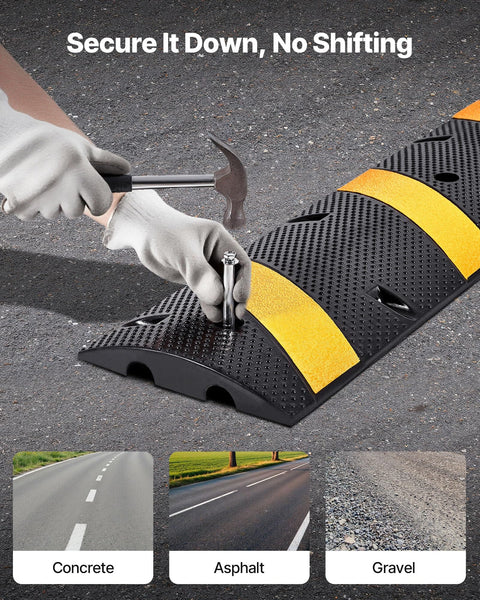 Person securing Beefy Rubber Driveway Speed Bumps 2-Pack, 6-Foot 2-Channel Modular Traffic Humps with screws on asphalt surface.