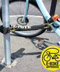 Beefed Up Heavy Duty 12mm Hardened Manganese Steel Bike Chain Lock securing blue bike to pole, E-Bike approved logo visible