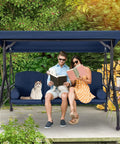 Three Seat Outdoor Porch Swing With Adjustable Canopy And Stand, Convertible Patio Glider Bed With Thick Cushions And Pillow, Upgraded Cup Holder, Heavy Duty All Metal Frame For Backyard Vibes Blue with couple and cat reading.