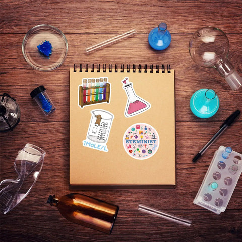 Notebook with 110 Piece Science Stickers Pack For Chemistry Biology Physics Fans, featuring vinyl decals and lab tools.