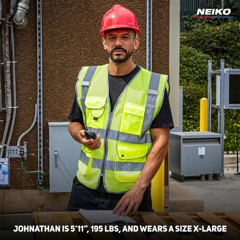 Built Different Neon Yellow Safety Vest With ANSI Class Two Reflective Striping And Nine Roomy Pockets For Construction Teams And Roadside Pros Wanting Top Shelf Coverage Locked In On Every Job Site, worn by worker, size XL.