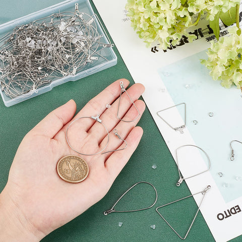 Hand displaying 48 Piece Earring Making Kit With Stainless Steel Wire And All The Hoop Findings Hooks Jump Rings Ear Nuts For DIY Jewelry Making Six Styles Like Teardrop Fan Triangle Ring Trapezoid And More Perfect Starter Set with coin for scale