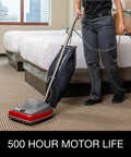 Tradition Upright Commercial Bagged Vacuum Cleaner Workhorse for heavy duty carpet cleaning in hotel room, in use