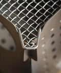 Close-up of the mesh top of Ultralight Titanium Camping Stove 7.7oz Flatpack Wood Burning Stove for Backpacking and Hiking.