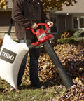 Person using Three In One Leaf Blower Vacuum With Metal Impeller And Infinite Variable Speed Up To Two Hundred Thirty Five MPH 12 Amp Power