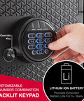Hand operating backlit digital keypad on Beefy Fireproof And Waterproof Safe with override key, focus on security features.