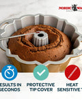 Reusable Bundt Cake Thermometer That Turns Red When Doneness Is Reached, in a Bundt cake, with protective silicone tip cover.
