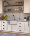 Modern kitchen with white cabinets featuring Solid Core Black Iron Cabinet Knobs For Kitchen And Dresser, One And One Quarter Inch Heavy Duty Metal Pulls For Doors And Drawers, Boss Level Refined Rustic Collection By Hickory Hardware, One Pack.