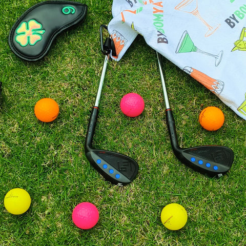 Full Face Forged Golf Wedge Set And Individual Wedges 50 52 54 56 58 60 Stainless Steel Milled Right Hand 60 Degree Forgiveness Wedges on grass with colorful golf balls, showcasing black club heads and full-face groove design.