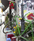 New York Fahgettaboutit Mini Bike U Lock With 18mm Hardened Shackle securing bike to pole with urban background