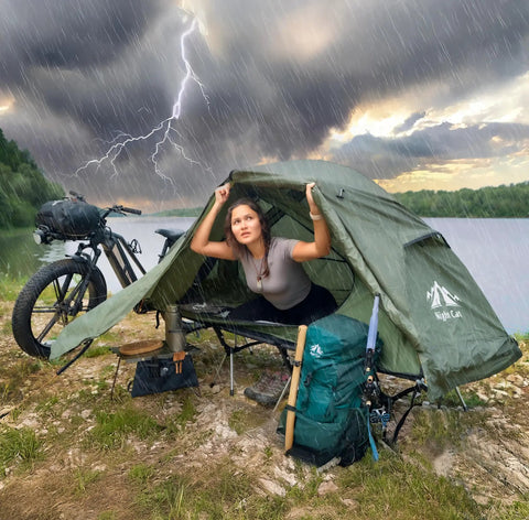 Camping Cot Tent Combo For Solo Adventures Waterproof Off Ground Bed For Adults 1 Person Ultra Portable Easy Setup Green 27.5 Inch Wide All Weather Comfort For Camping Backyard And Campground in stormy weather