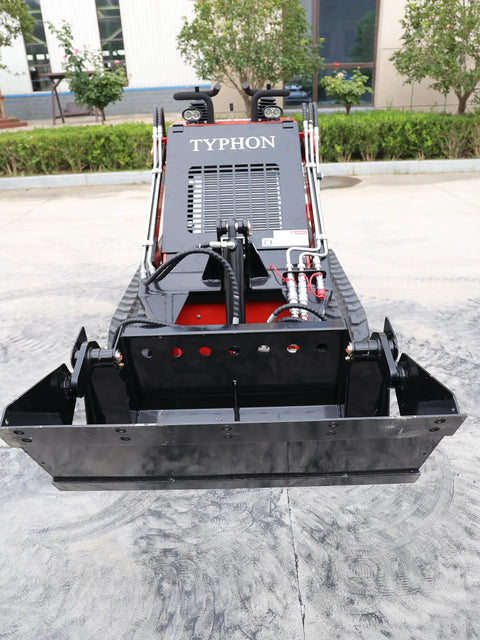 Front view of Mini Skid Steer Loader 1800 Lb Capacity With Four In One Bucket Attachment, parked on concrete.