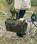 Person holding Waxed Canvas Firewood Carrier Tote For Camping And Garden Work, Collapsible And Sturdy Tool Storage Basket in army green