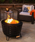 Outdoor patio with Mini Fire Pit Tabletop Torch Set Two Pack for Patio Backyard and Garden Black Metal Flame Torches.