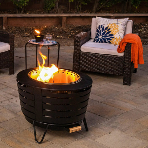 Outdoor patio with Mini Fire Pit Tabletop Torch Set Two Pack for Patio Backyard and Garden Black Metal Flame Torches.