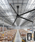 Heavy Duty 144 Inch HVLS Industrial Ceiling Fan With Five Slick Aluminum Blades And 200W Ridiculously Quiet DC Motor in a warehouse.