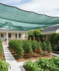Beefed Up 35 To 45 Percent Sun Shade Cloth 10 By 20 Feet Green HDPE Mesh installed over garden