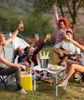 Group enjoying picnic with Ultra Portable Folding Camp Table With Aluminum Build 24 Inch Long By 16 Inch Wide Adjustable Height Legs