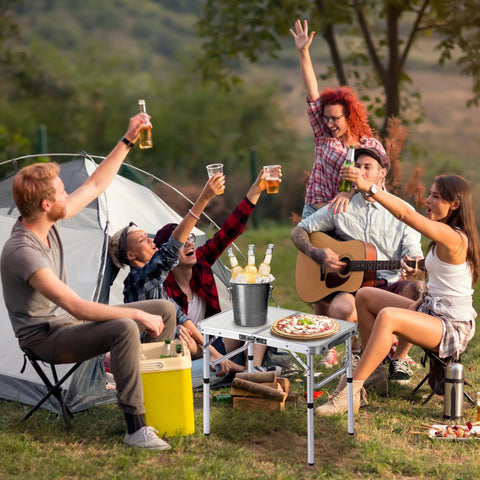 Group enjoying picnic with Ultra Portable Folding Camp Table With Aluminum Build 24 Inch Long By 16 Inch Wide Adjustable Height Legs