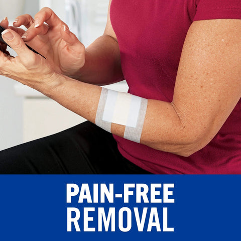 Nexcare tape on forearm; two white adhesive strips for sensitive skin
