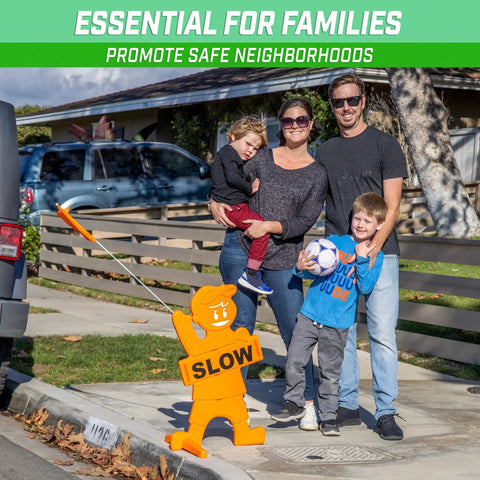 Family standing near Kids At Play Street Safety Sign With High Visibility Neon Orange Design, All Weather Durability, Includes Warning Flag