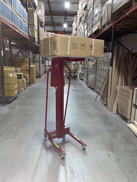 Full Size Manual Hand Winch Work Positioner Lift Truck For Warehouse with package on lift in storage area.