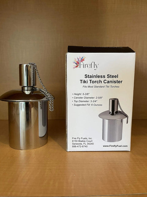 Polished Stainless Steel Table Top Tiki Torch Canister With Refillable Fuel Reservoir For Outdoor Use beside packaging box