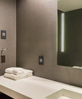 Modern bathroom with Adorne Tamper Resistant Self Test GFCI Outlet 15A Magnesium Finish With Matching Wall Plate