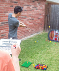 Person practicing with Chipping Net With Mat For Golf Practice, Pop Up Swing Trainer For Backyard Or Indoor Use, Easy Setup