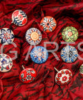 12 Pack Vintage Flower Ceramic Cabinet Knobs And Door Pulls, 42mm Diameter With 35 To 45mm Bolt displayed on red fabric