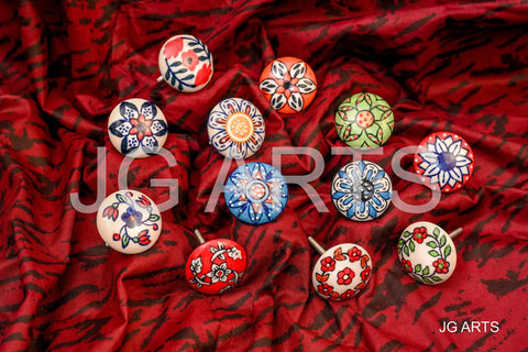 12 Pack Vintage Flower Ceramic Cabinet Knobs And Door Pulls, 42mm Diameter With 35 To 45mm Bolt displayed on red fabric