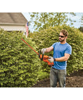 Man using 40V Max Hedge Trimmer With 22 Inch Dual Action Blade Low Vibration for Smooth Cuts Up To Three Quarters Inch Thick Wraparound Handle