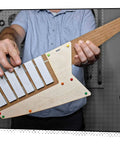 Keytar Invention Launchpad Starter Bundle For Hands On STEM Coding Learning Build Your Own Musical Instrument Kit That Lets Kids Create Code Play And Customize An Educational Instrument, wooden keytar held in hands