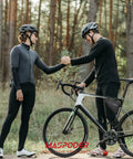 Two cyclists shaking hands beside a road bike with Beginner Friendly Ride Ready Bike Tool Kit With Frame Bag attached.