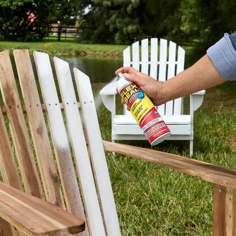 Applying White 14 Oz Waterproof Rubber Spray On Sealant Coating That Stops Leaks Instantly Flexible After Drying Ideal For Gutters Wood RVs Campers Roofs Skylights Windows And More on wooden chair